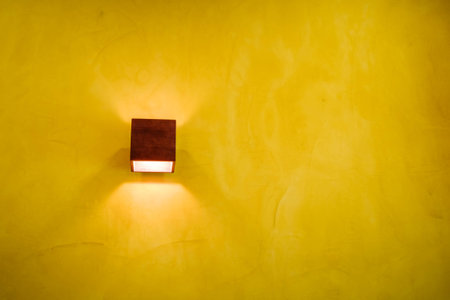 Handmade lamp on yellow wallの写真素材
