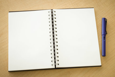 Blank notebook and penの写真素材