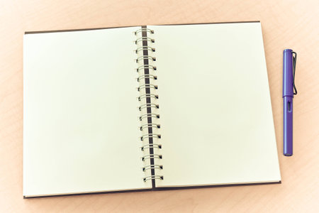 blank notebook and penの写真素材