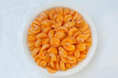 orange on white dishの写真素材