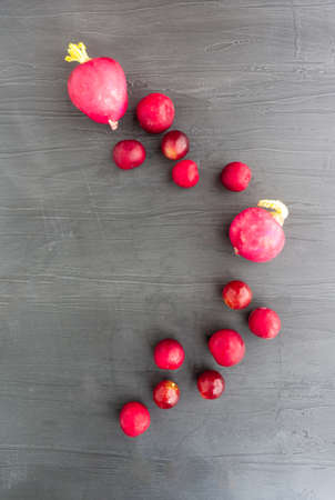 Red vegetables and fruit over gray backgroundの写真素材