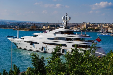 SYRACUSE, ITALY - October 06, 2012: Private yacht in Syracuse Harbor. Sicilyのeditorial素材