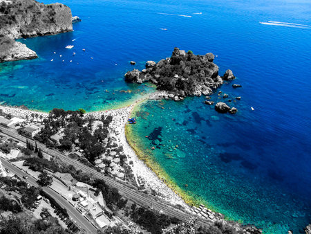 A personal elaboration in the selective color of the Isola Bella in Taormina. Sicilyの写真素材