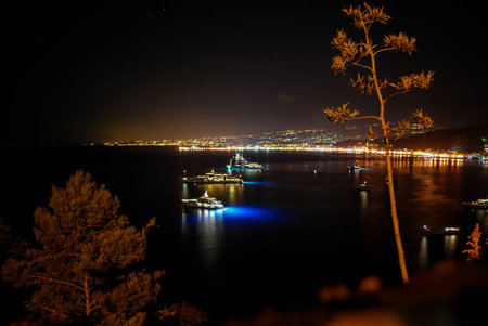 Long-exposure night shot of Naxos Bay in Taormina. Sicilyの写真素材