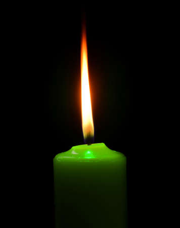 green candle on black の写真素材