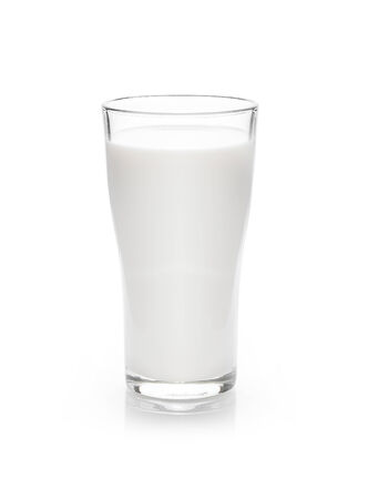  milk in the glass on white backgroundの写真素材
