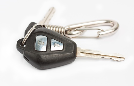 Old car key with remote control on white backgroundの写真素材