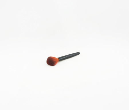 Blush brush with black handle placed on a white background.                               の写真素材