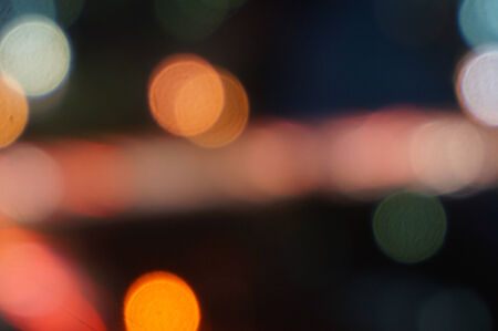 Night lights bokeh of a wide variety of colors including red, green, yellow, blue, orange and white.                               の写真素材