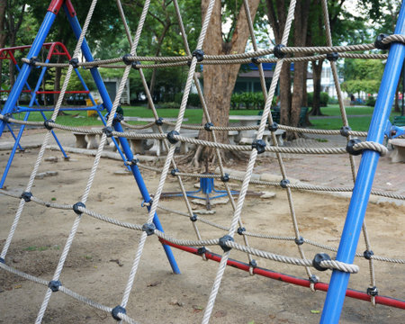 Netting for climbing with a thick rope for children climb on the playground.の写真素材