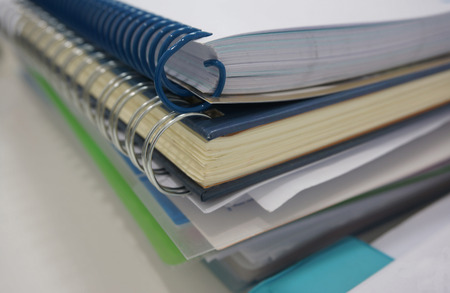 Office documents, the paper notes, account book placed on the desk at work.の写真素材