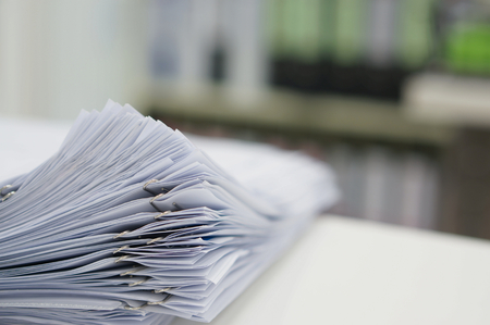 Stack of data document are placed on desk in office.の写真素材