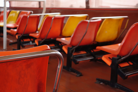 Seats row inside ferry boat with empty passengers seats.の写真素材