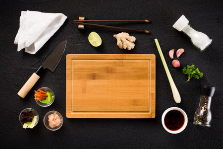 Asian food ingredients and cutting board top view
