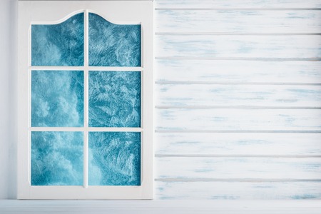 White wooden wall and a frosted window backgroundの写真素材