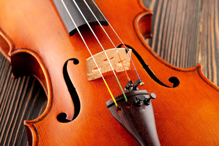 Close up of a violin detail on wooden table