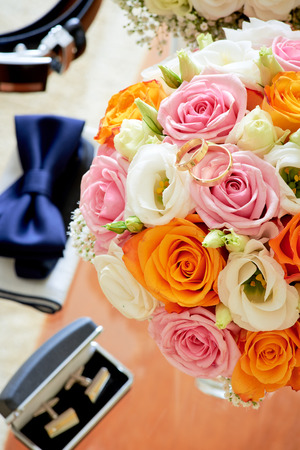 Bouquet flowers, weddings rings and components top viewの写真素材