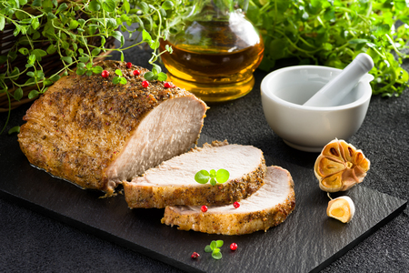 Roasted pork loin with garlic and marjoramの写真素材