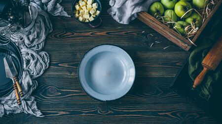 Apple pie making process, empty plate on the tableの写真素材