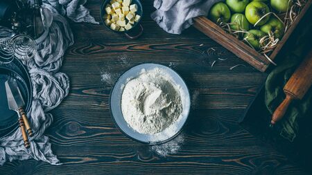 Apple pie making process, flour in the plateの写真素材