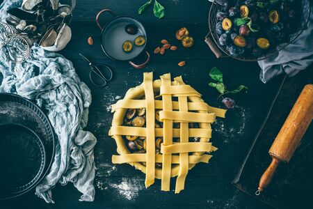 Plum pie making process, decorating cakeの写真素材