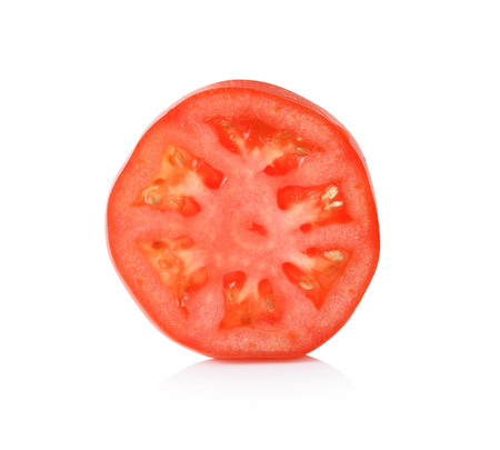 Tomato slice isolated on white backgroundの写真素材