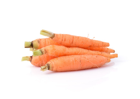 Fresh baby carrots on white backgroundの写真素材