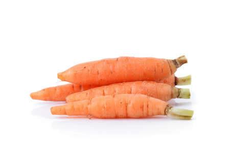 Fresh baby carrots on white backgroundの写真素材