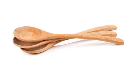 wooden spoon on white background.の写真素材