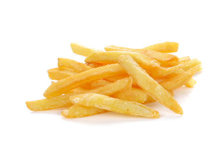 a pile of appetizing french fries on a white backgroundの写真素材