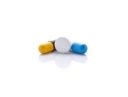 pills and capsules isolated on white backgroundの写真素材