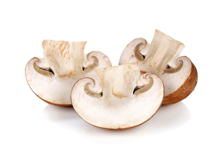 fresh champignon mushrooms isolated on whiteの写真素材