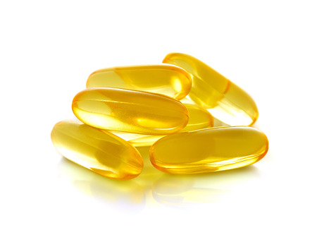 fish oil capsules isolated on a white backgroundの写真素材