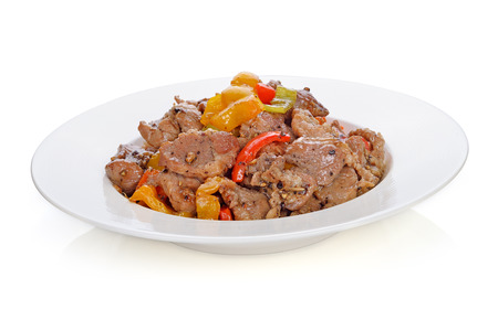 Thai food. stir fry pork with pepper chilli on white backgroundの写真素材