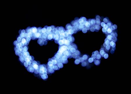 Blue bokeh heart shapes background.の写真素材