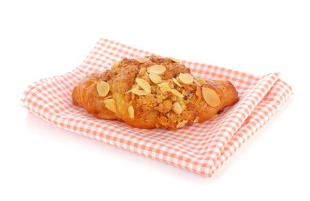 Croissant with almond on a white backgroundの写真素材