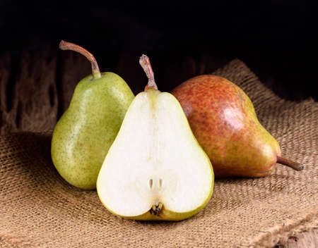 fresh ripe pears on wooden tableの写真素材