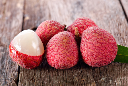 lychee fruit on wooden backgroundの写真素材