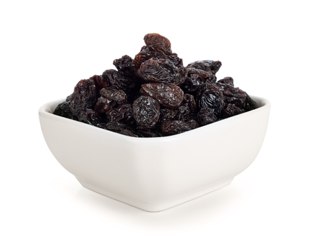 Dried raisins on white background.の写真素材