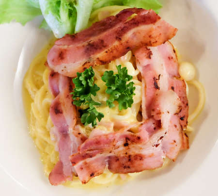 spaghetti carbonara sauce and bacon.の写真素材
