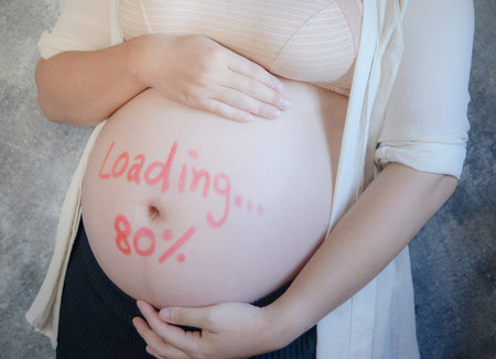 Close up of pregnant belly.
