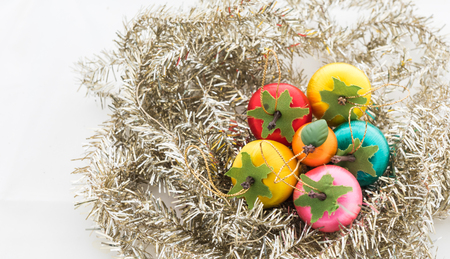 Christmas silver tinsel. and colorful ball Isolated on a white backgroundの写真素材