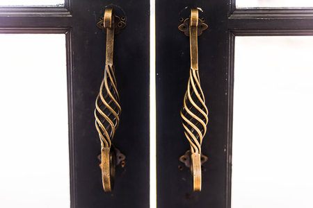 Old brass handle on green wood doorの写真素材