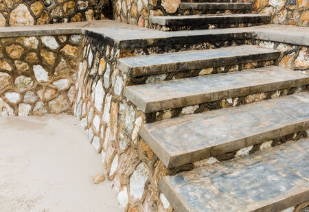 Weathered concrete stairs with mold, faded paint.,crumbling. on the beachの写真素材