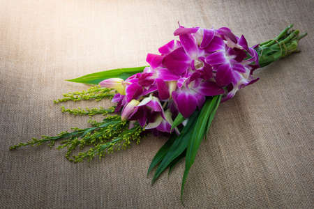 Orchid Bouquet on sackcloth backgroundの写真素材