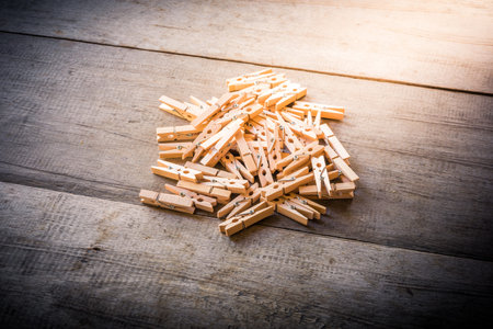 Group of Clothes peg on wooden background