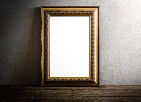 still life of luxurious photo frame on wooden table over grunge background. vintage toneの写真素材