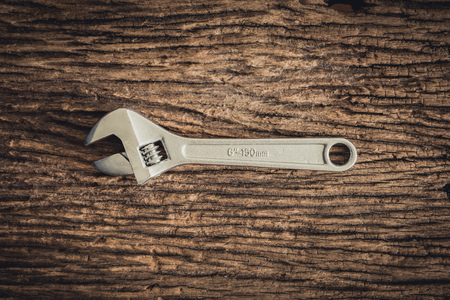 One Wrench on wooden backgroundの写真素材