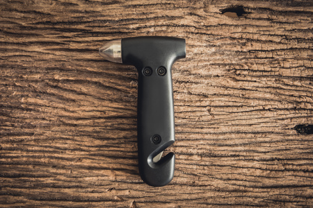 emergency hammer rescue hammer on wooden backgroundの写真素材
