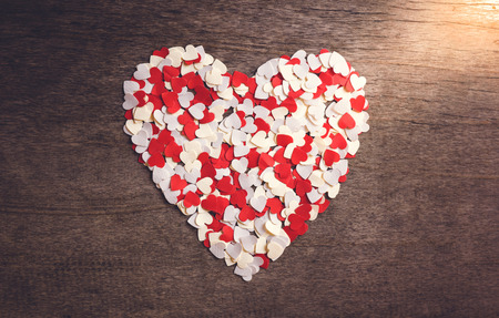 A small heart-shaped paper Arranged a big heart. Valentine conceptの写真素材